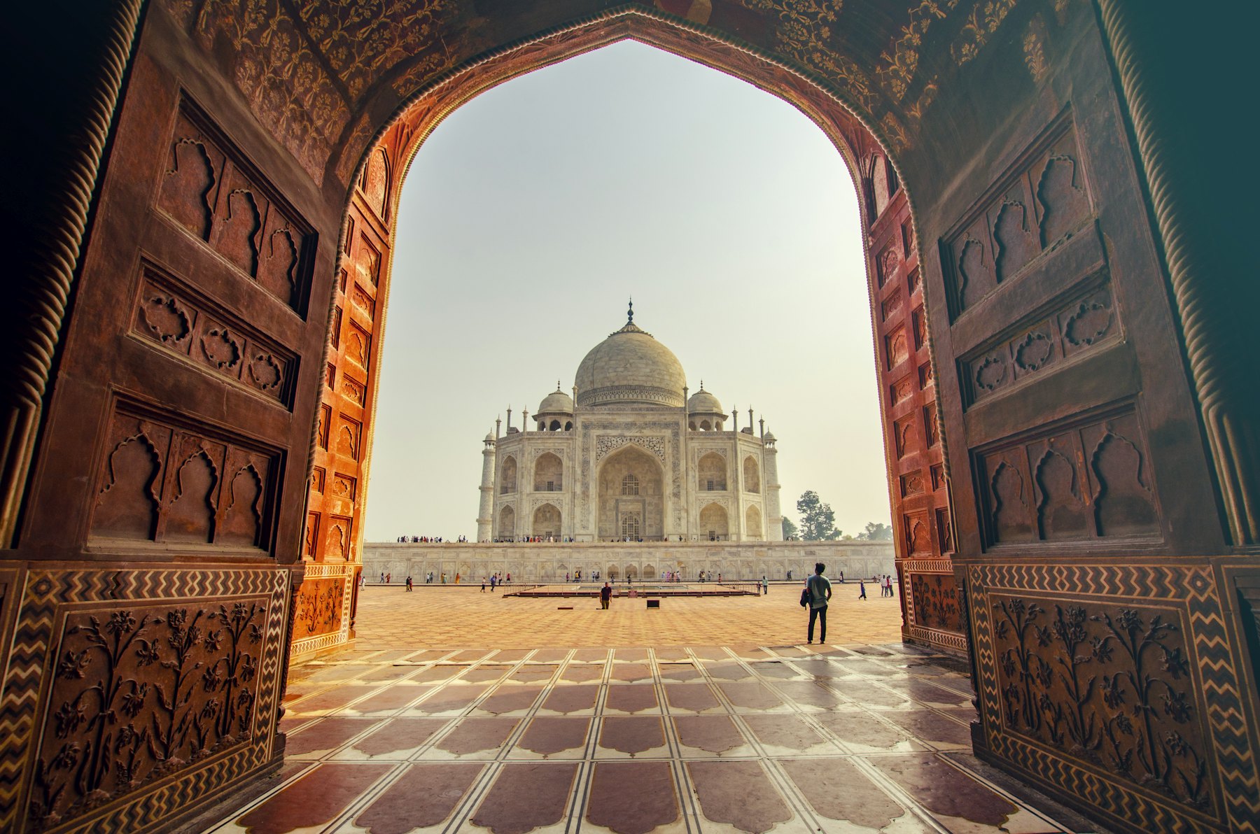 The Taj Mahal seen through a carved archway
